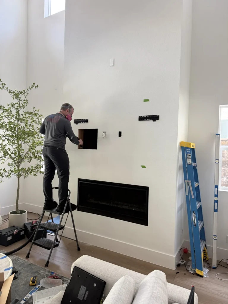 TV wall recess cutting above linear fireplace