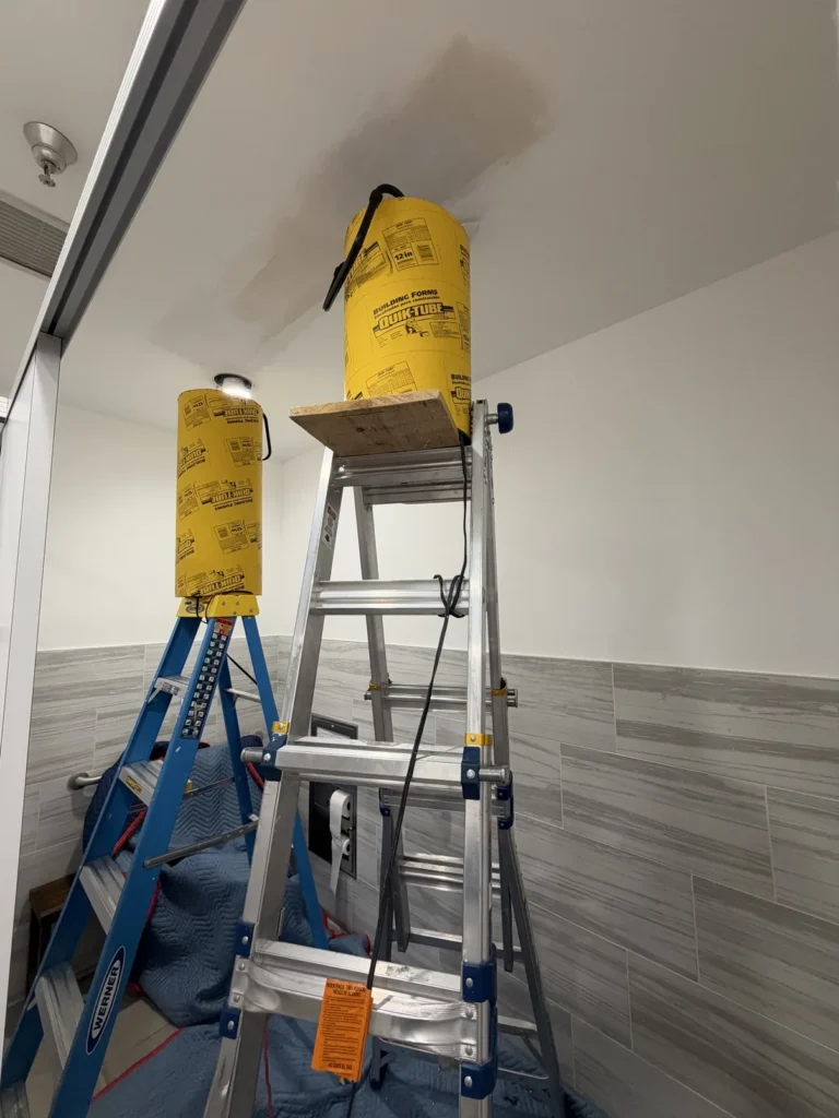 Ceiling drywall repair with fan drying setup